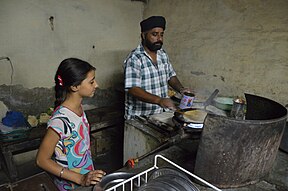 Photo of father and daughter cooking