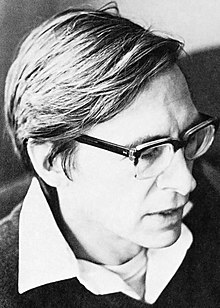 Black-and-white portrait photograph of John Rawls wearing glasses